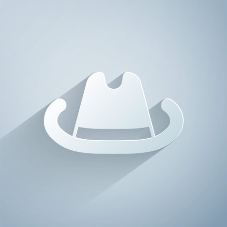 Paper cut Western cowboy hat icon isolated on grey background. Paper art style. Vectorのイラスト素材