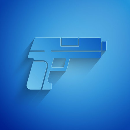 Paper cut Pistol or gun icon isolated on blue background. Police or military handgun. Small firearm. Paper art style. Vectorのイラスト素材