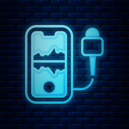 Glowing neon Mobile recording icon isolated on brick wall background. Mobile phone with microphone. Voice recorder app smartphone interface. Vectorのイラスト素材
