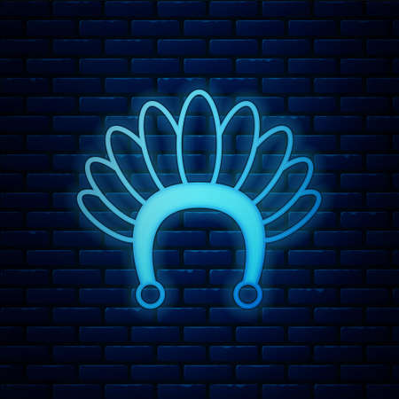 Glowing neon Indian headdress with feathers icon isolated on brick wall background. Native american traditional headdress. Vectorのイラスト素材