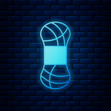 Glowing neon Yarn icon isolated on brick wall background. Label for hand made, knitting or tailor shop. Vectorのイラスト素材