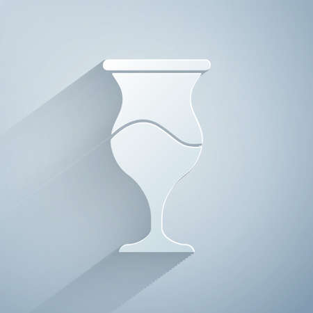 Paper cut Jewish goblet icon isolated on grey background. Jewish wine cup for kiddush. Kiddush cup for Shabbat. Paper art style. Vectorのイラスト素材
