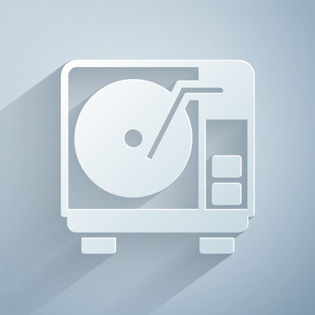 Paper cut Vinyl player with a vinyl disk icon isolated on grey background. Paper art style. Vectorのイラスト素材