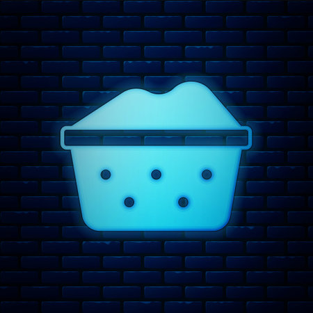 Glowing neon Plastic basin with soap suds icon isolated on brick wall background. Bowl with water. Washing clothes, cleaning equipment. Vectorのイラスト素材