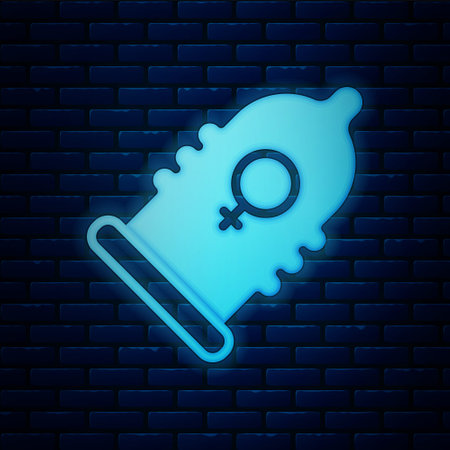 Glowing neon Condom safe sex icon isolated on brick wall background. Safe love symbol. Contraceptive method for males. Vector.のイラスト素材