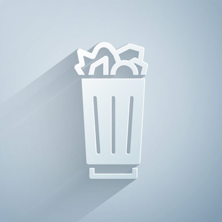 Paper cut Full trash can icon isolated on gray background. Garbage bin sign. Recycle basket icon. Office trash icon. Paper art style. Vector.のイラスト素材