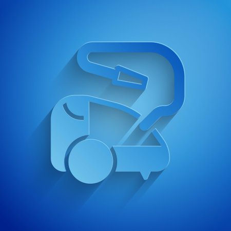 Paper cut Vacuum cleaner icon isolated on blue background. Paper art style. Vector.のイラスト素材