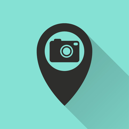 Camera pin vector icon with long shadow. Black illustration isolated on green background for graphic and web design.のイラスト素材