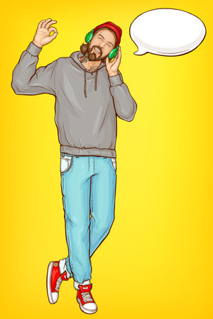 Smiling hipster man in hoody, jeans and sneakers, listening music with headphones, talking on phone with wireless headset, showing OK hand gesture pop art vector full-length portrait with speak cloudのイラスト素材