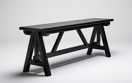 Black trestle bench against a white background.の素材