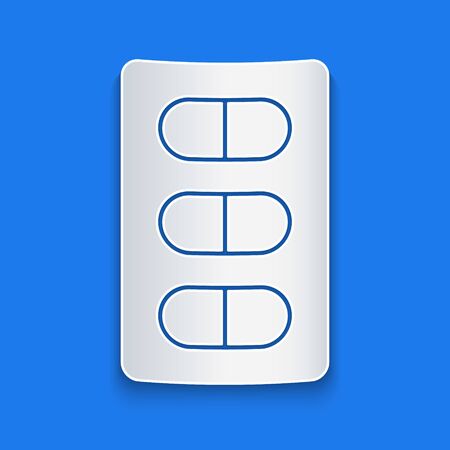 Paper cut Pills in blister pack icon isolated on blue background. Medical drug package for tablet, vitamin, antibiotic, aspirin. Paper art style. Vector Illustrationのイラスト素材