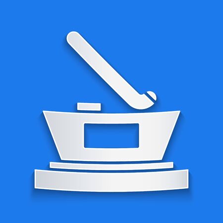 Paper cut Ice hockey cup champion icon isolated on blue background. Hockey trophy. Paper art style. Vector Illustrationのイラスト素材