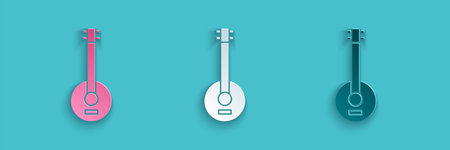Paper cut Banjo icon isolated on blue background. Musical instrument. Paper art style. Vector...