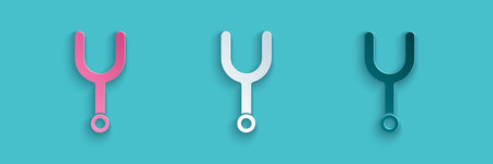 Paper cut Musical tuning fork for tuning musical instruments icon isolated on blue background. Paper...