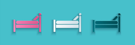 Paper cut Bed icon isolated on blue background. Paper art style. Vector Illustrationのイラスト素材