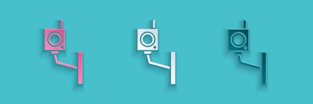 Paper cut Security camera icon isolated on blue background. Paper art style. Vector Illustration