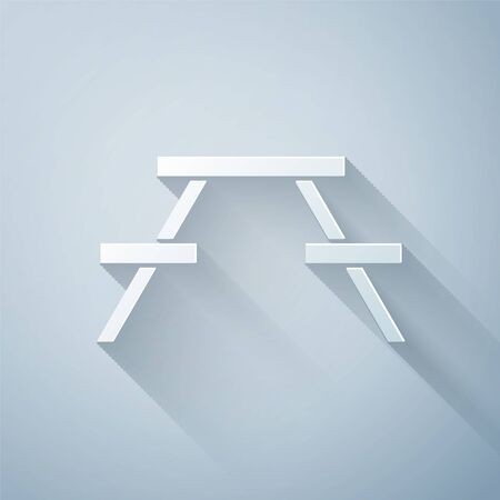 Paper cut Picnic table with benches on either side of the table icon isolated on grey background. Paper art style. Vector Illustrationのイラスト素材