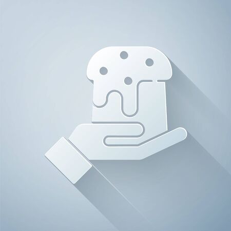 Paper cut Human hand and easter cake icon isolated on grey background. Happy Easter. Paper art style. Vector Illustrationのイラスト素材