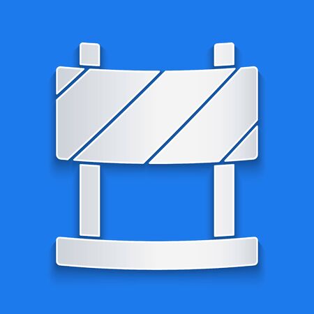Paper cut Road barrier icon isolated on blue background. Symbol of restricted area which are in under construction processes. Repair works. Paper art style. Vector Illustrationのイラスト素材