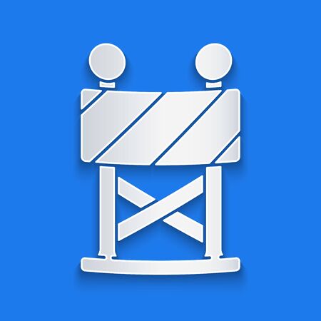 Paper cut Road barrier icon isolated on blue background. Symbol of restricted area which are in under construction processes. Repair works. Paper art style. Vector Illustrationのイラスト素材