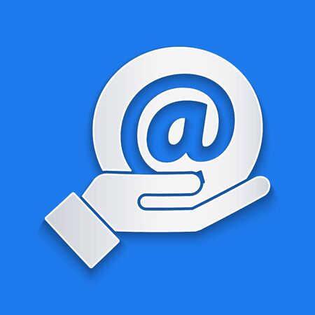 Paper cut Mail and e-mail in hand icon isolated on blue background. Envelope symbol e-mail. Email message sign. Paper art style. Vector Illustrationのイラスト素材