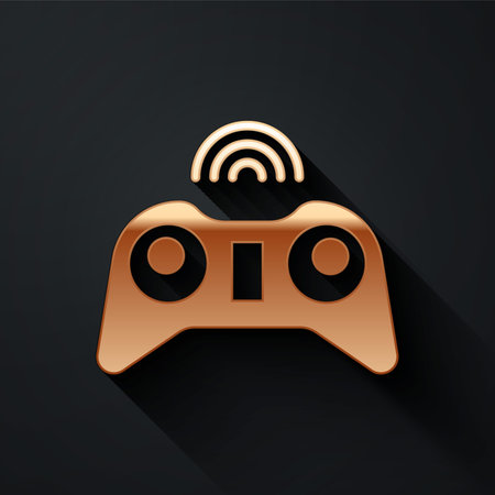 Gold Wireless gamepad icon isolated on black background. Game controller. Long shadow style. Vector...