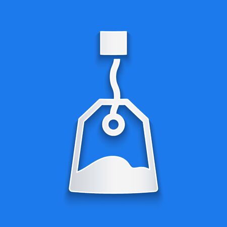 Paper cut Tea bag icon isolated on blue background. Paper art style. Vectorのイラスト素材