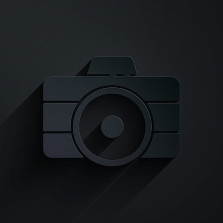 Paper cut Photo camera icon isolated on black background. Foto camera icon. Paper art style. Vector Illustrationのイラスト素材