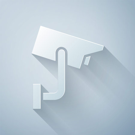 Paper cut Security camera icon isolated on grey background. Paper art style. Vector Illustration.