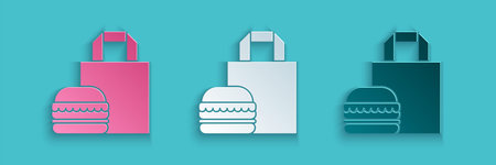 Paper cut Online ordering and burger delivery icon isolated on blue background. Paper art style....
