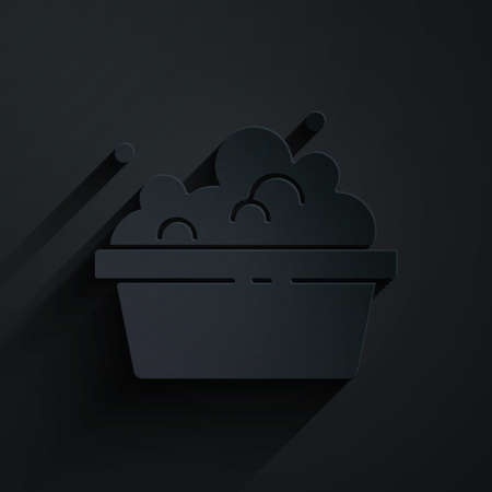 Paper cut Plastic basin with soap suds icon isolated on black background. Bowl with water. Washing clothes, cleaning equipment. Paper art style. Vectorのイラスト素材