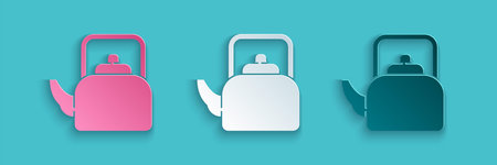 Paper cut Kettle with handle icon isolated on blue background. Teapot icon. Paper art style. Vector
