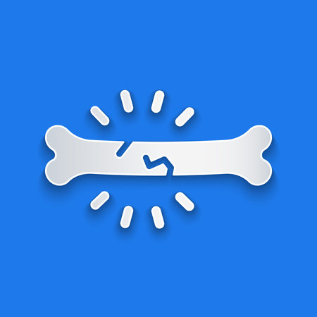 Paper cut Bone pain icon isolated on blue background. Orthopedic medical. Disease of the joints and...
