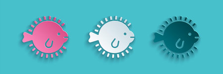 Paper cut Puffer fish icon isolated on blue background. Fugu fish japanese puffer fish. Paper art...