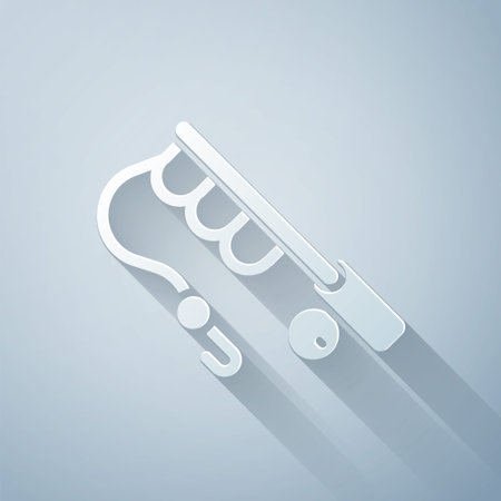 Paper cut Fishing rod icon isolated on grey background. Fishing equipment and fish farming topics. Paper art style. Vectorのイラスト素材