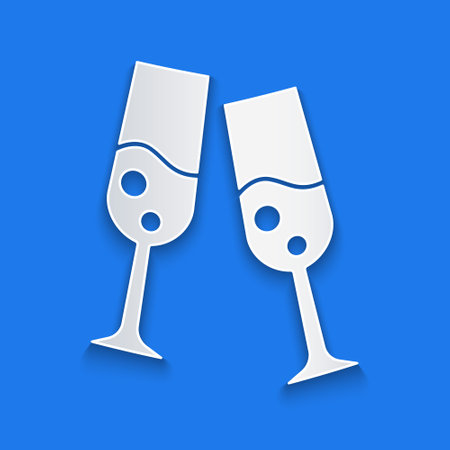 Paper cut Glass of champagne icon isolated on blue background. Merry Christmas and Happy New Year. Paper art style. Vectorのイラスト素材