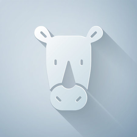 Paper cut Rhinoceros icon isolated on grey background. Animal symbol. Paper art style. Vectorのイラスト素材