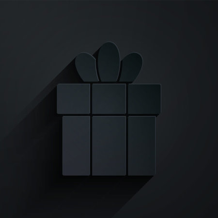 Paper cut Gift box icon isolated on black background. Merry Christmas and Happy New Year. Paper art style. Vectorのイラスト素材