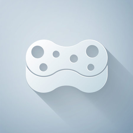 Paper cut Sponge icon isolated on grey background. Wisp of bast for washing dishes. Cleaning service logo. Paper art style. Vectorのイラスト素材