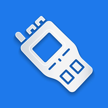 Paper cut Walkie talkie icon isolated on blue background. Portable radio transmitter icon. Radio transceiver sign. Paper art style. Vectorのイラスト素材