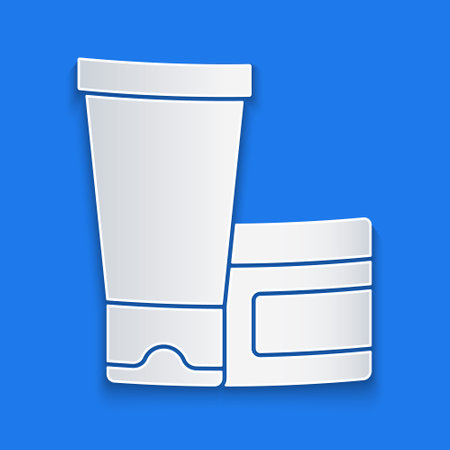 Paper cut Cream or lotion cosmetic tube icon isolated on blue background. Body care products for woman. Paper art style. Vectorのイラスト素材