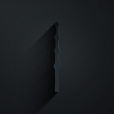Paper cut Magic wand icon isolated on black background. Star shape magic accessory. Magical power. Paper art style. Vectorのイラスト素材