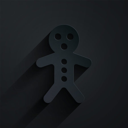 Paper cut Holiday gingerbread man cookie icon isolated on black background. Cookie in shape of man with icing. Paper art style. Vectorのイラスト素材
