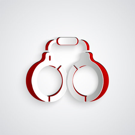 Paper cut Handcuffs icon isolated on grey background. Paper art style. Vectorのイラスト素材
