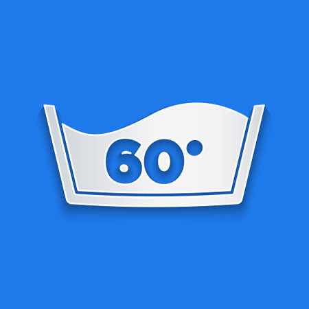 Paper cut Washing under 60 degrees celsius icon isolated on blue background. Temperature wash. Paper art style. Vectorのイラスト素材