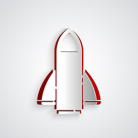 Paper cut Rocket ship icon isolated on grey background. Space travel. Paper art style. Vectorのイラスト素材