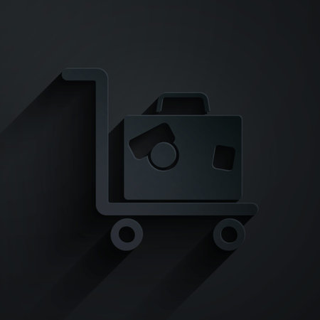 Paper cut Hotel luggage cart with suitcase icon isolated on black background. Traveling baggage sign. Travel luggage icon. Paper art style. Vectorのイラスト素材