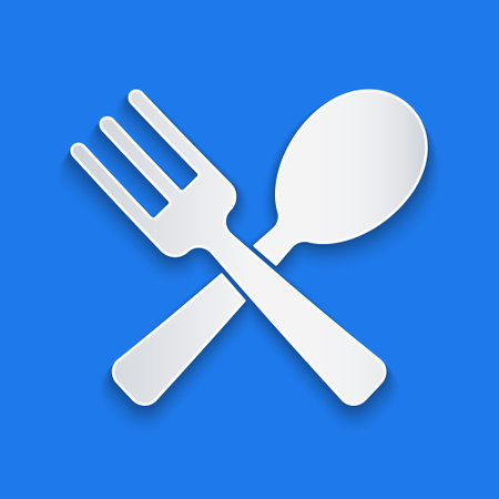 Paper cut Crossed fork and spoon icon isolated on blue background. Cooking utensil. Cutlery sign. Paper art style. Vectorのイラスト素材