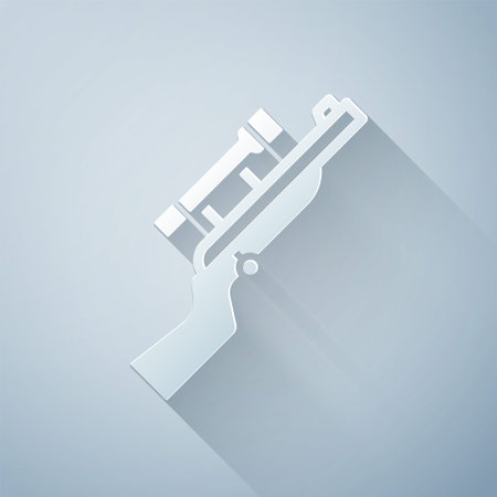 Paper cut Sniper rifle with scope icon isolated on grey background. Paper art style. Vectorのイラスト素材