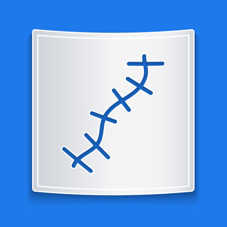 Paper cut Scar with suture icon isolated on blue background. Paper art style. Vectorのイラスト素材